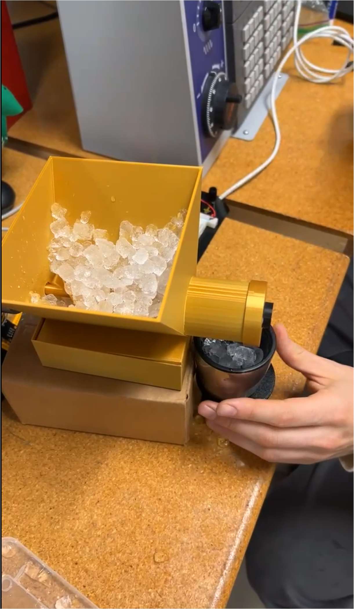 Top-down view of ice flowing into the cup