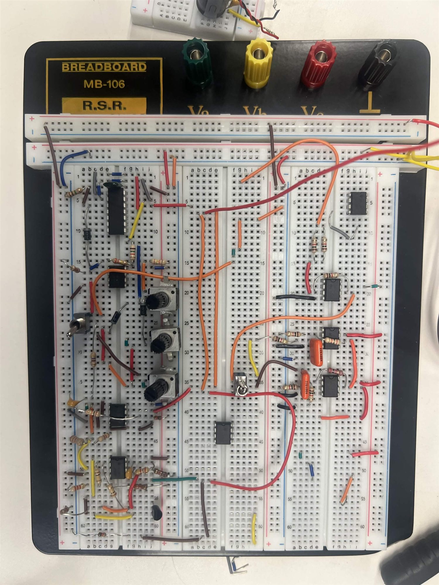 Main synthesizer breadboard with three potentiometers and signal routing