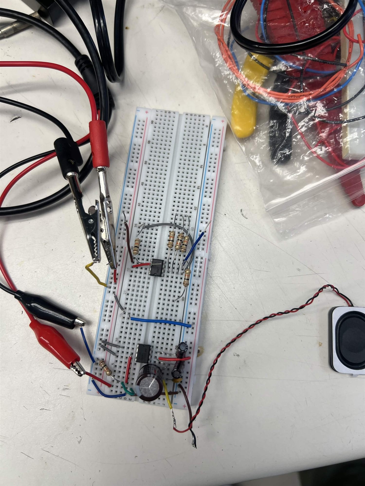Standalone LM386 audio amplifier breadboard connected to a small speaker